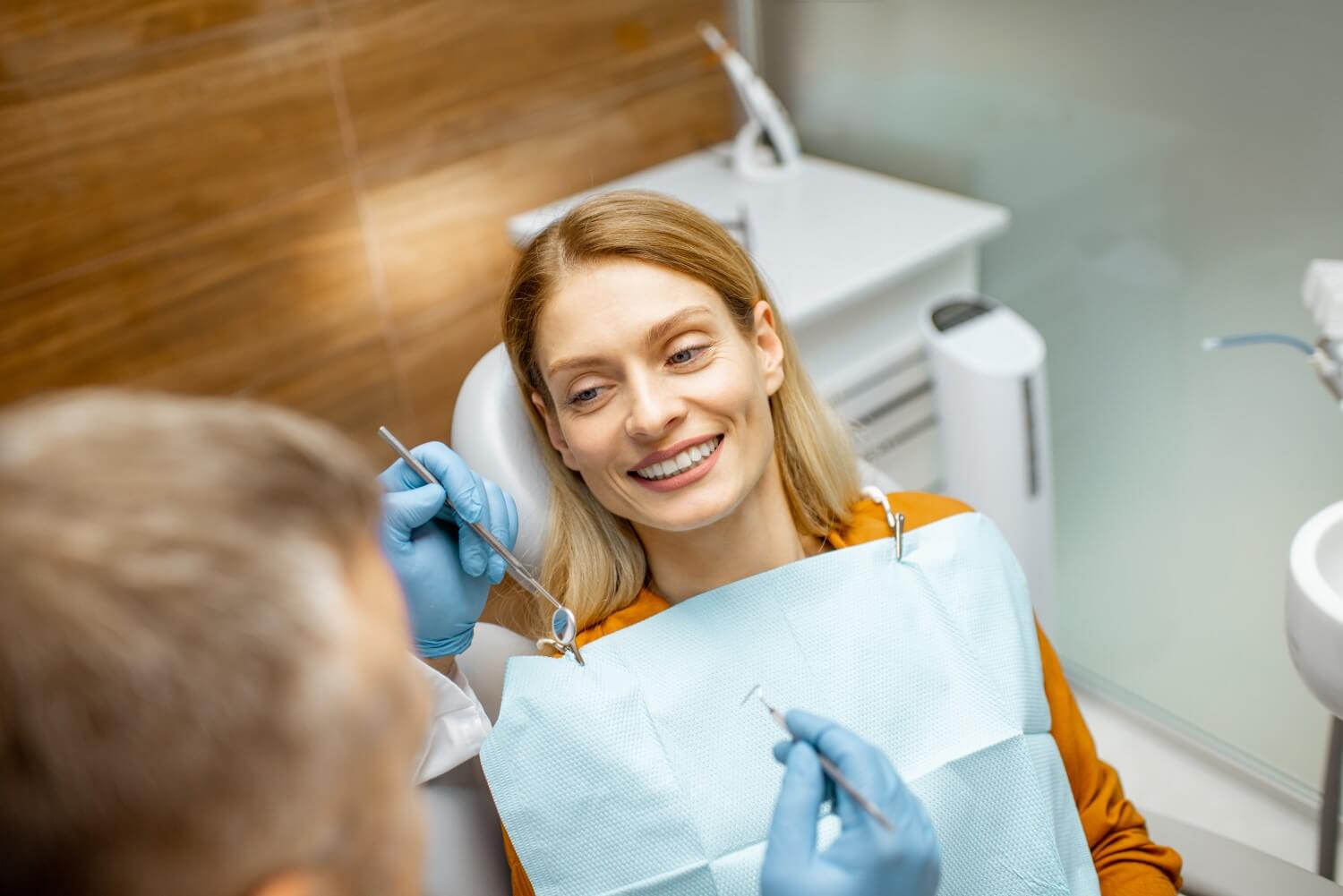 woman receiving a preventive dental care check up woman receiving a preventive dental care check up
